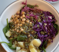 A colorful kitchen sink salad loaded with seasonal ingredients